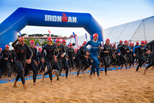 Ironman mass swim start on the beach